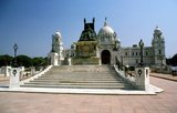 The Victoria Memorial Hall was built between 1906 and 1921 and is dedicated to the memory of Queen Victoria (1819–1901), Empress of India. The memorial was built in an Indo-Saracenic revivalist style and the architect was William Emerson (1843 - 1924).

The tax records of Mughal Emperor Akbar (1584–1598) as well as the work of a 15th century Bengali poet, Bipradaas, both mention a settlement named Kalikata (thought to mean ‘Steps of Kali’ for the Hindu goddess Kali) from which the name Calcutta is believed to derive.

In 1690 Job Charnock, an agent of the East India Company, founded the first modern settlement in this location. In 1698 the company purchased the three villages of Sutanuti, Kolikata and Gobindapur. In 1727 the Calcutta Municipal Corporation was formed and the city’s first mayor was appointed.

In 1756 the Nawab of Bengal, Siraj ud-Daulah, seized Calcutta and renamed the city Alinagar. He lost control of the city within a year and Calcutta was transferred back to British control. In 1772 Calcutta became the capital of British India on the orders of Governor Warren Hastings.

In 1912 the capital was transferred to New Delhi while Calcutta remained the capital of Bengal. Since independence and partition it has remained the capital and chief city of Indian West Bengal.