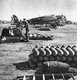 Spain: Ground crews of the Condor Legion prepare fuel and bombs for loading onto Heinkel He-111 during the Spanish Civil War, c. 1937